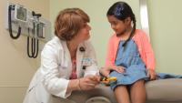 Pediatrician with a child patient